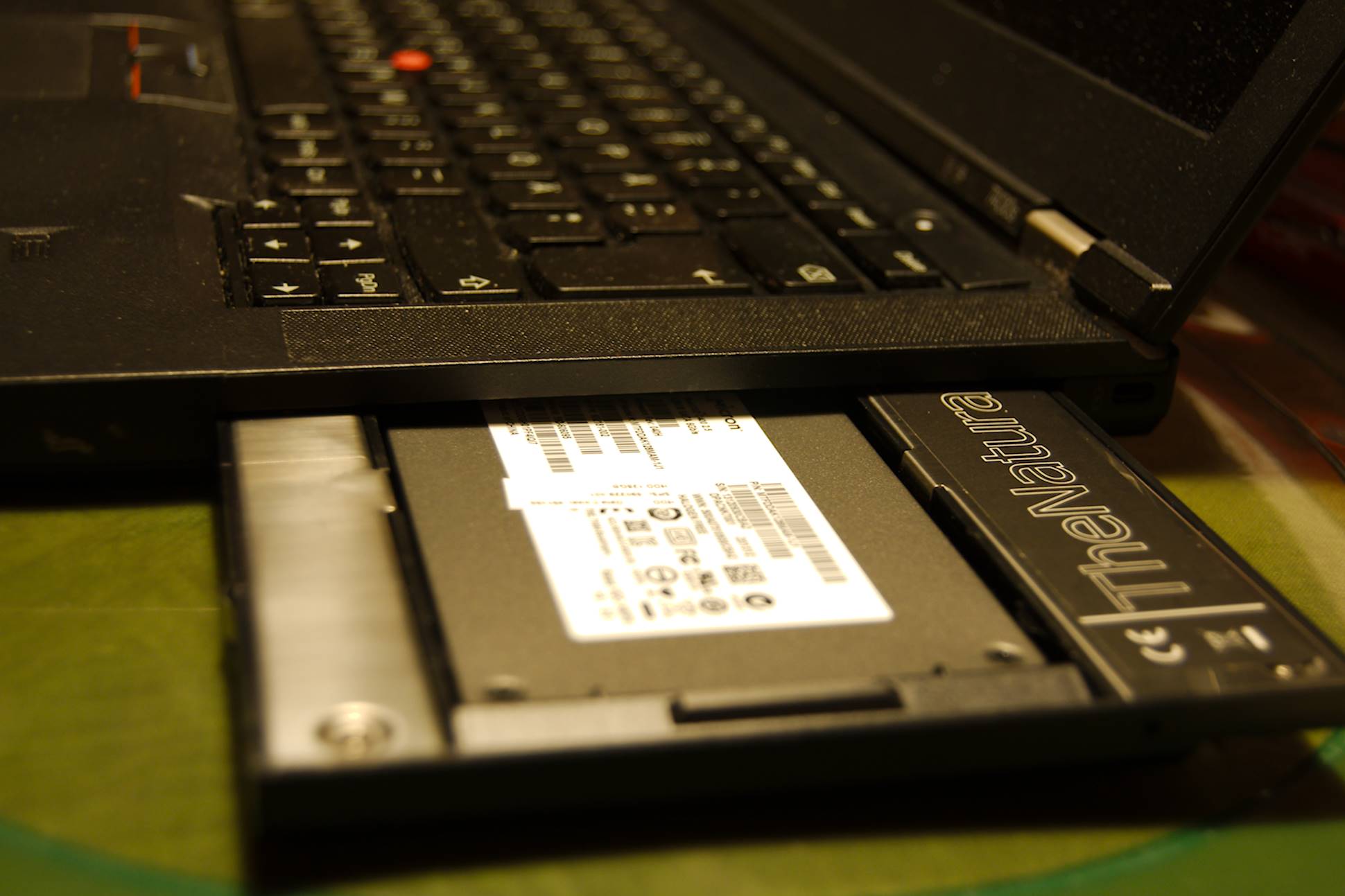 The ultrabay with the SSD halfway inserted in the slot on the Lenovo ThinkPad T430s [photo: Henrik Hemrin]